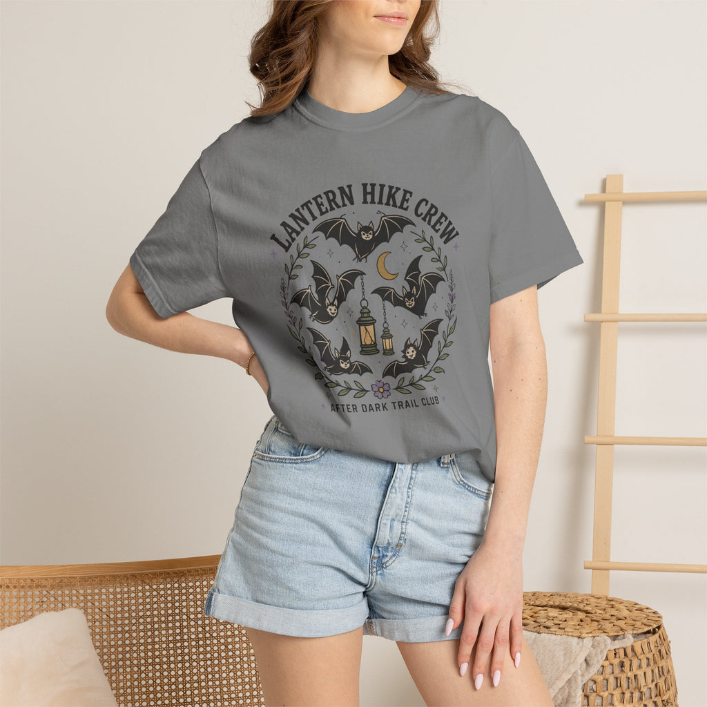 Grey Comfort Colors t-shirt featuring a lantern glowing on a switchback trail under the moon, Trail & Ember Co.