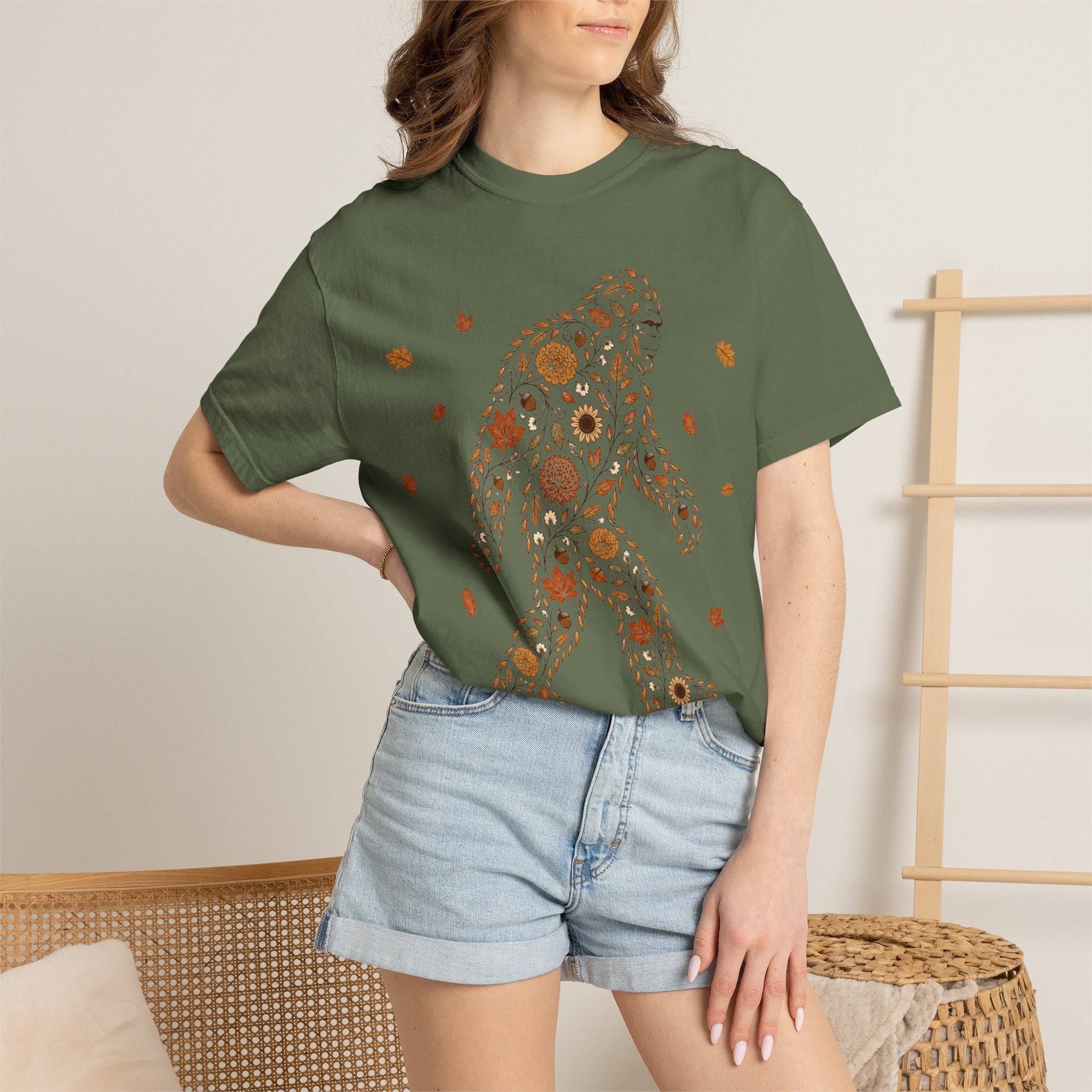 Close-up of the Autumn Big Foot print design on a Sage Comfort Colors t-shirt