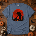 Blue Jean Comfort Colors t-shirt featuring Bigfoot booping a black cat's nose in front of a red autumn moon, with maple leaves and pine trees, Trail & Ember Co.