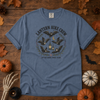 Blue Jean Comfort Colors t-shirt featuring a lantern glowing on a switchback trail under the moon, Trail & Ember Co.
