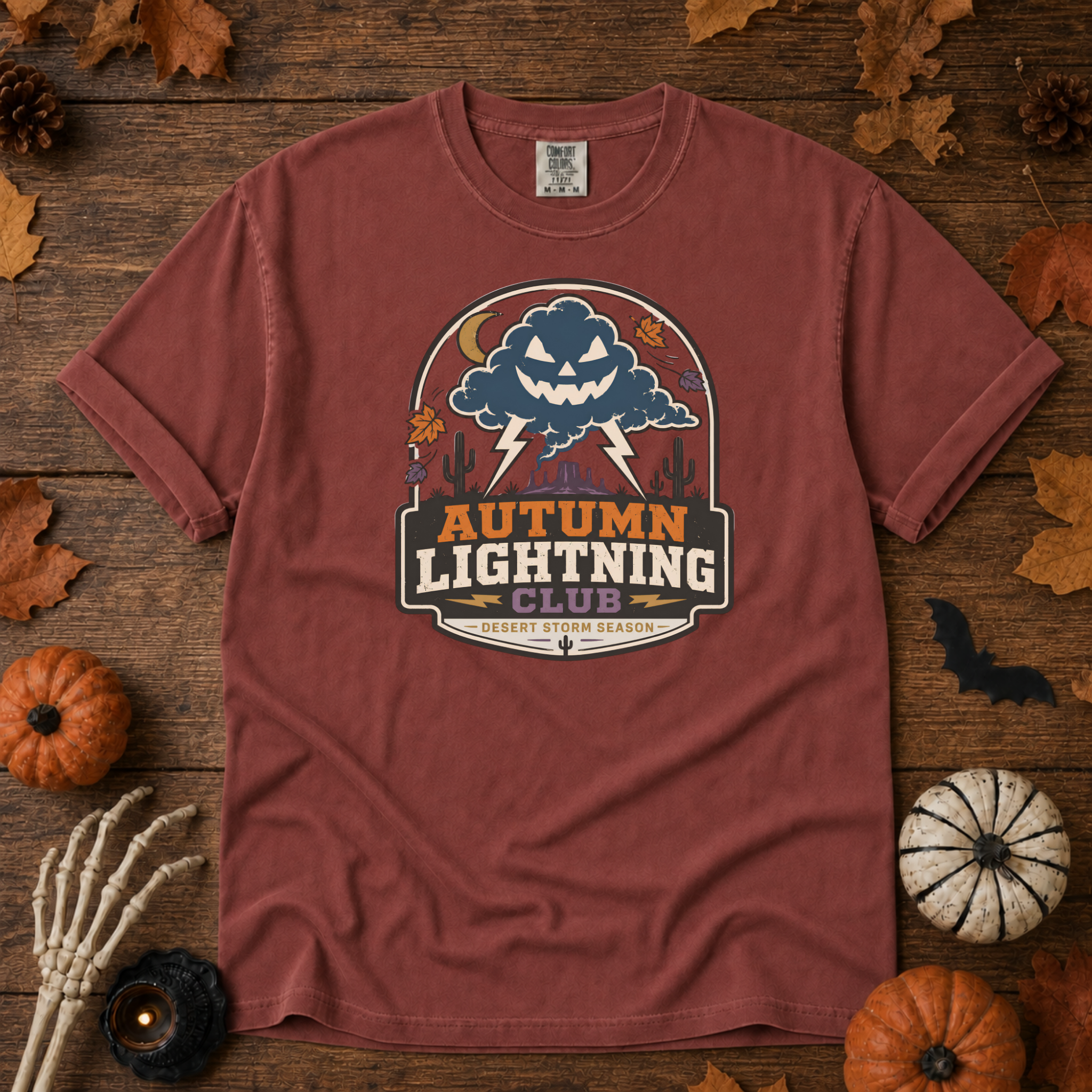 Brick Comfort Colors t-shirt featuring lightning splitting the sky over a lone saguaro with storm clouds rolling across the desert, Trail & Ember Co.