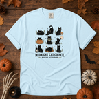 Chambray Comfort Colors t-shirt featuring a circle of cats on a fence line at midnight with eyes catching the porch light, Trail & Ember Co.
