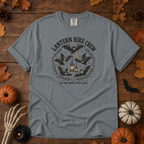 Granite Comfort Colors t-shirt featuring a lantern glowing on a switchback trail under the moon, Trail & Ember Co.