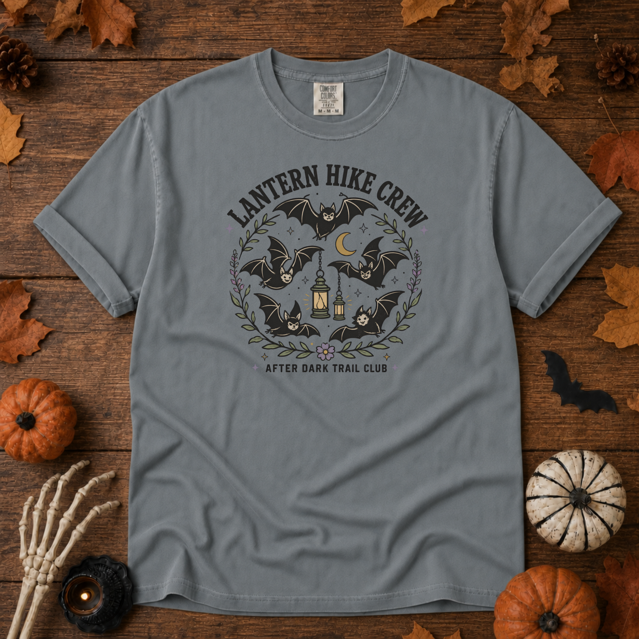 Granite Comfort Colors t-shirt featuring a lantern glowing on a switchback trail under the moon, Trail & Ember Co.