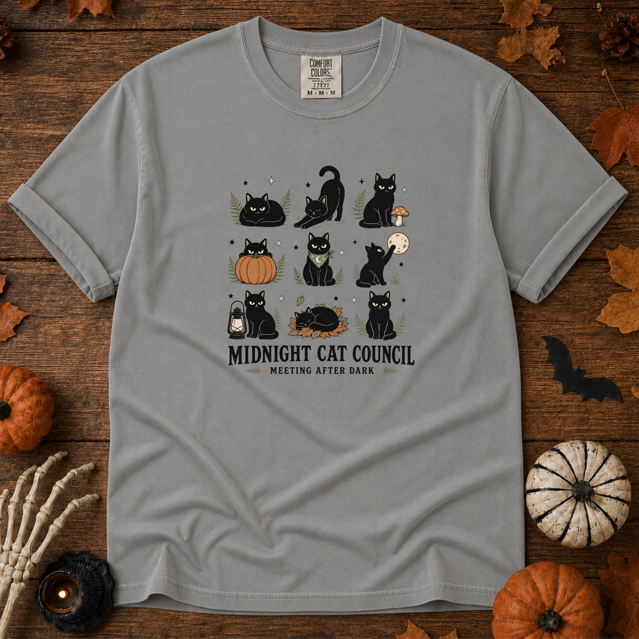 Grey Comfort Colors t-shirt featuring a circle of cats on a fence line at midnight with eyes catching the porch light, Trail & Ember Co.