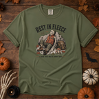 Sage Comfort Colors t-shirt featuring a skeleton wrapped head to rib in fleece, propped against a lantern, Trail & Ember Co.