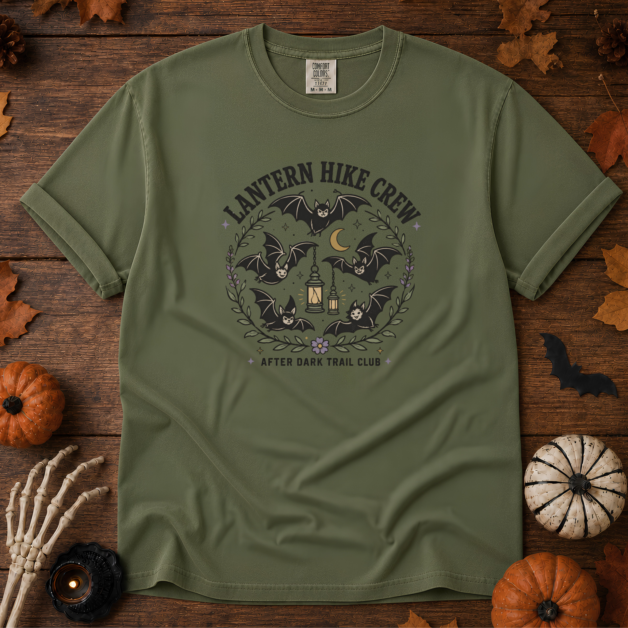 Sage Comfort Colors t-shirt featuring a lantern glowing on a switchback trail under the moon, Trail & Ember Co.