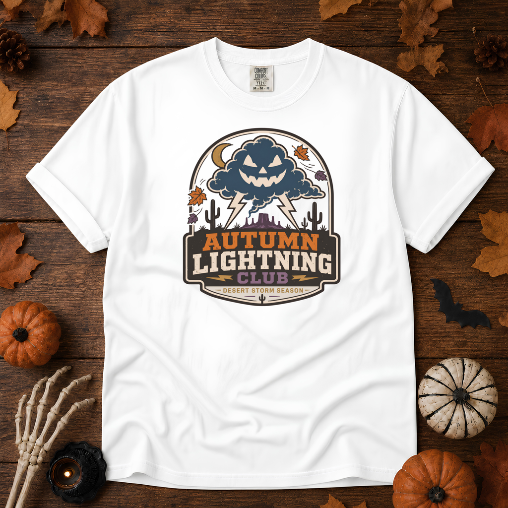 White Comfort Colors t-shirt featuring lightning splitting the sky over a lone saguaro with storm clouds rolling across the desert, Trail & Ember Co.