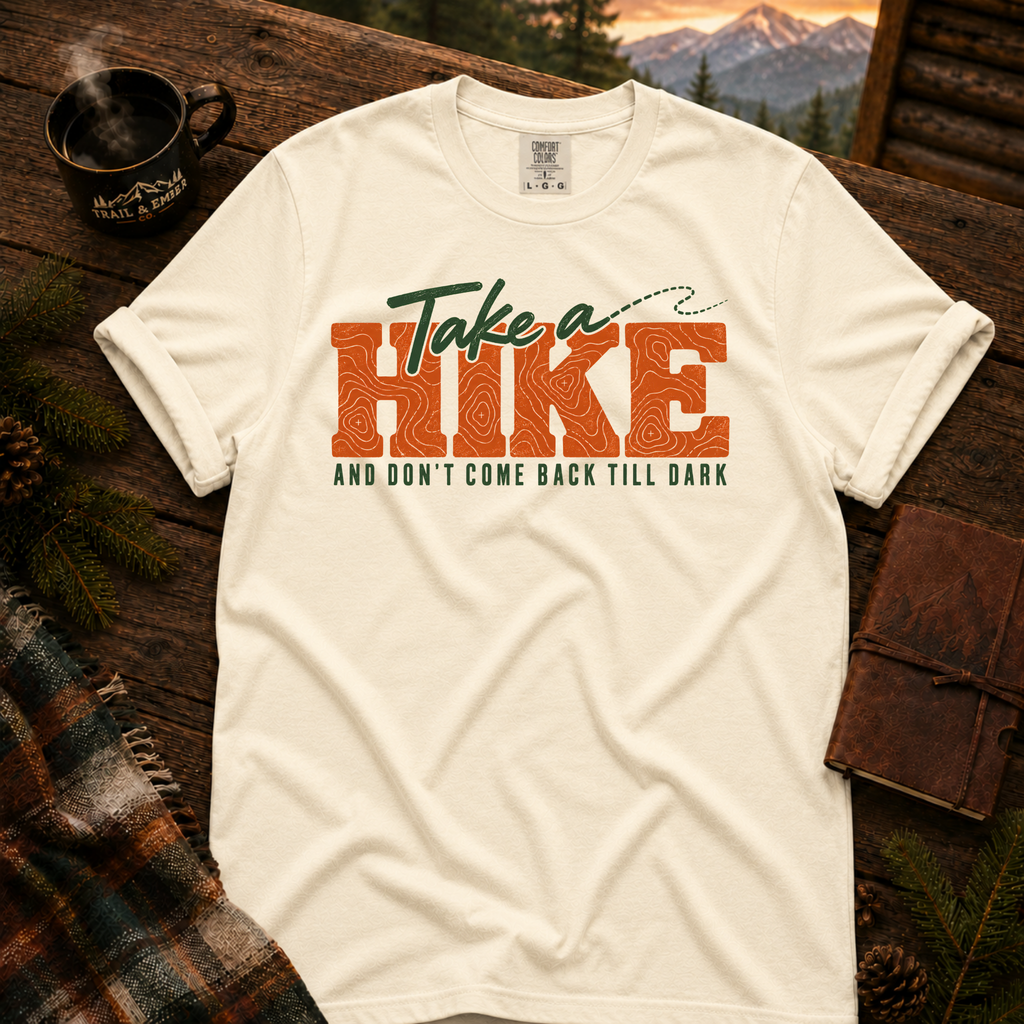 Ivory Comfort Colors T-shirt with Take a Hike topo lettering and And Don't Come Back Till Dark slogan.
