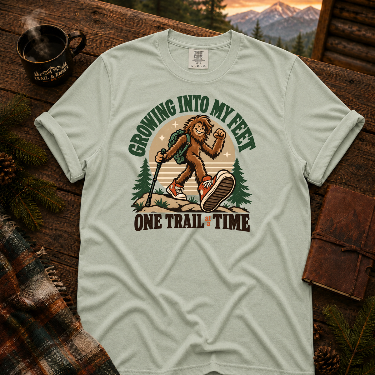 Bay Comfort Colors T-shirt with Teen Bigfoot hiking in orange sneakers with Growing Into My Feet lettering.