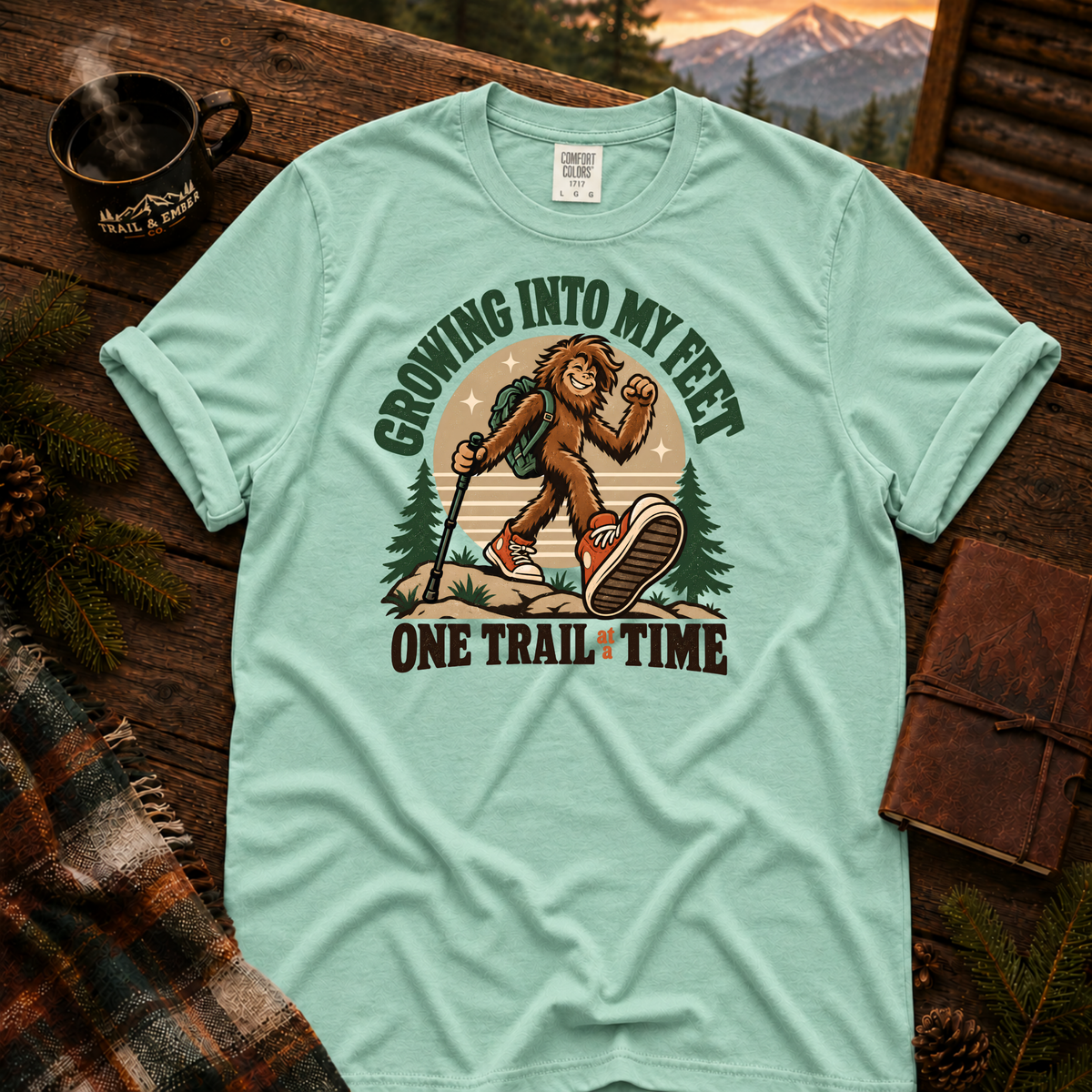 Island Reef Comfort Colors T-shirt with Teen Bigfoot hiking in orange sneakers with Growing Into My Feet lettering.