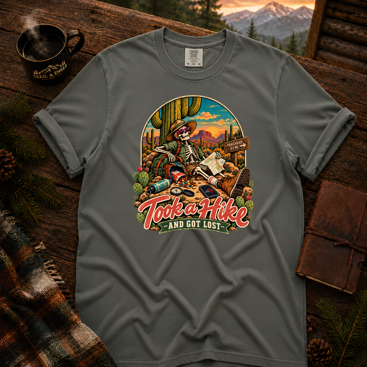 Pepper Comfort Colors T-shirt with Took a Hike and Got Lost skeleton resting beside a cactus with a map.