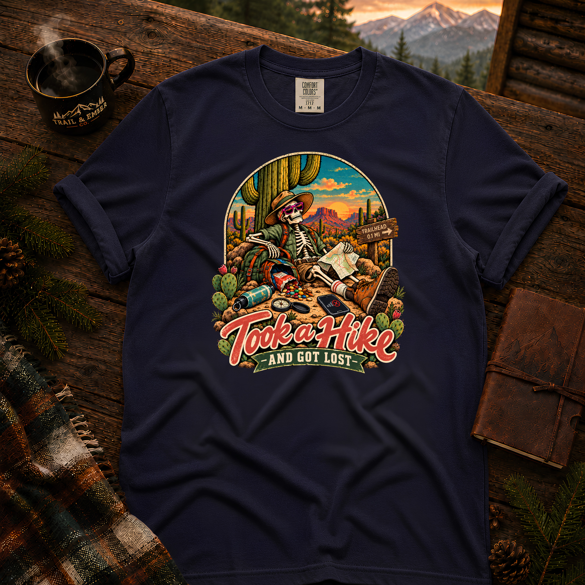 True Navy Comfort Colors T-shirt with Took a Hike and Got Lost skeleton resting beside a cactus with a map.