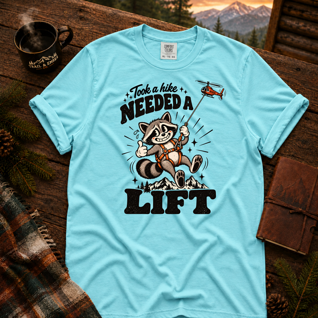 Lagoon Blue Comfort Colors T-shirt with Took a Hike, Needed a Lift raccoon and rescue helicopter design.