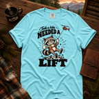 Lagoon Blue Comfort Colors T-shirt with Took a Hike, Needed a Lift raccoon and rescue helicopter design.